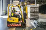 Forklift operator moving cargo