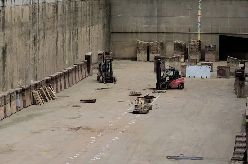 Forklifts operating inside a warehouse